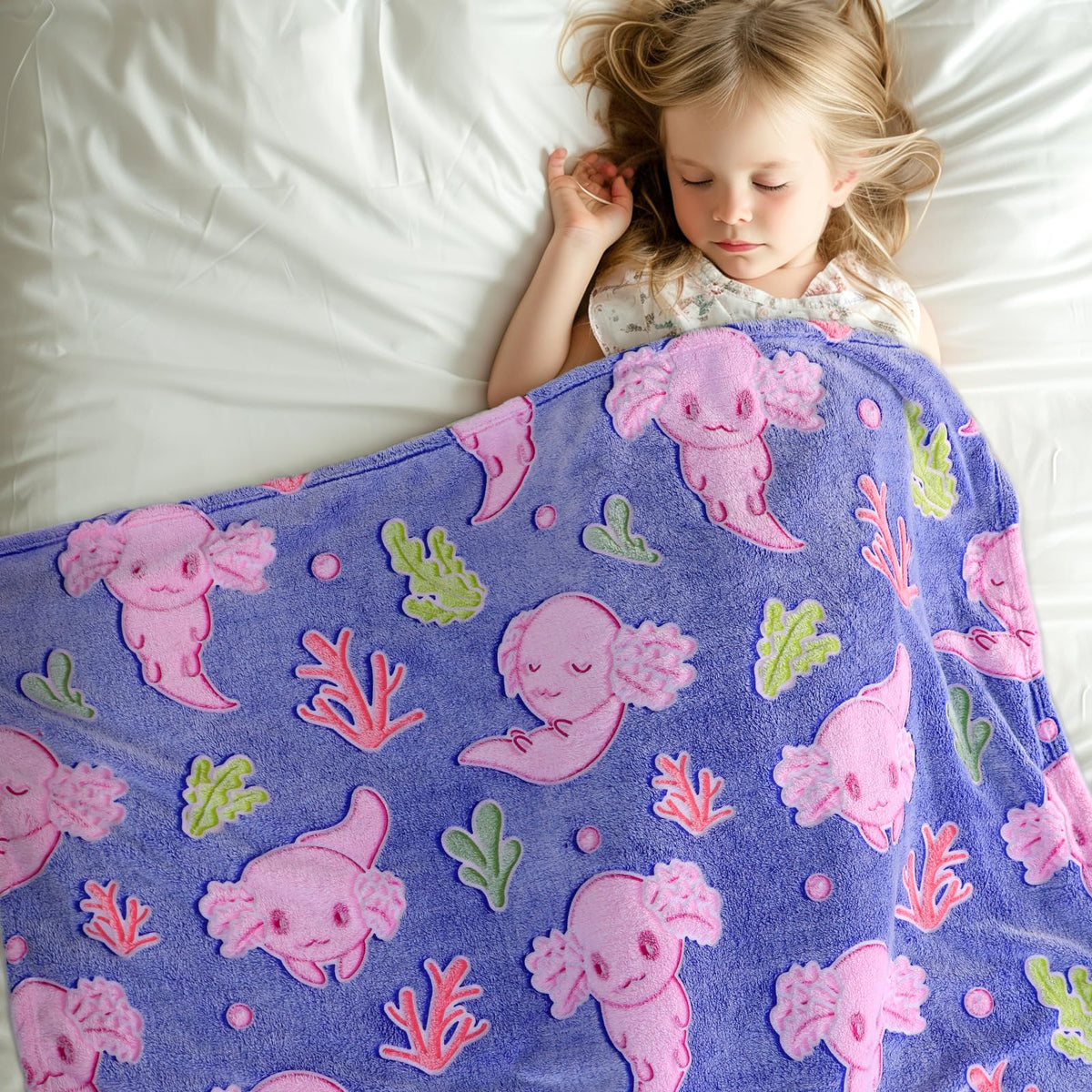 IMUKU axolotl blanket glows in the dark after light exposure.