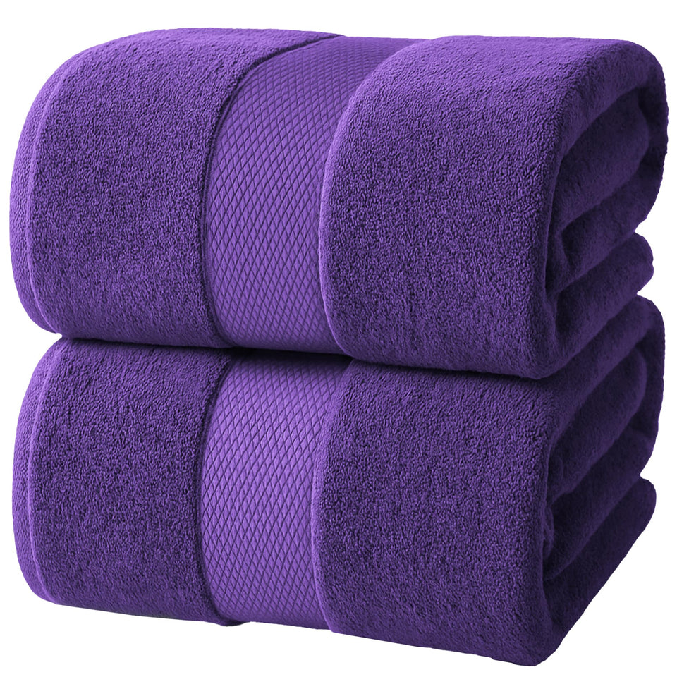 Infinitee Xclusives jumbo bath sheet folded, plush and highly absorbent for quick drying.