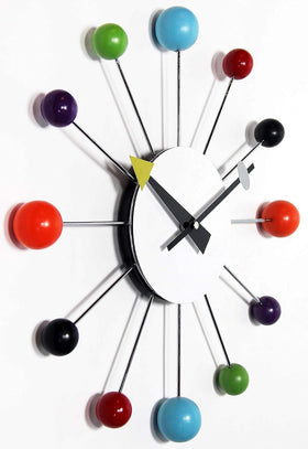 Infinity Instruments Orb Spoke clock uses quiet quartz movement for peaceful rooms.
