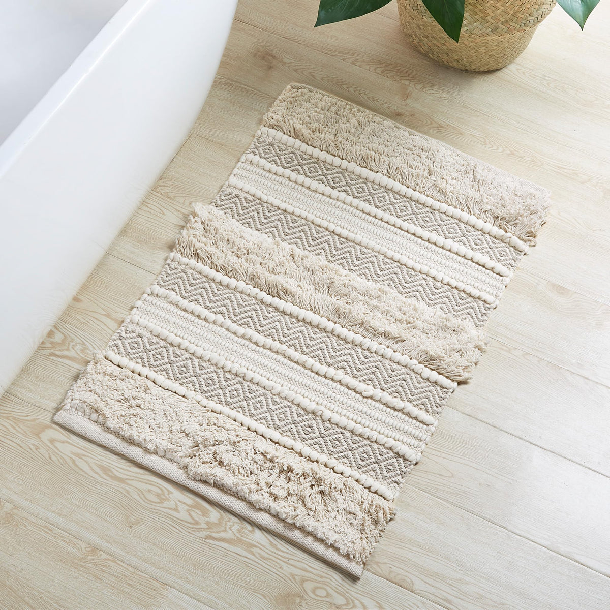 INK+IVY Asher bath rug with woven stripe texture adds boho style and soft comfort.
