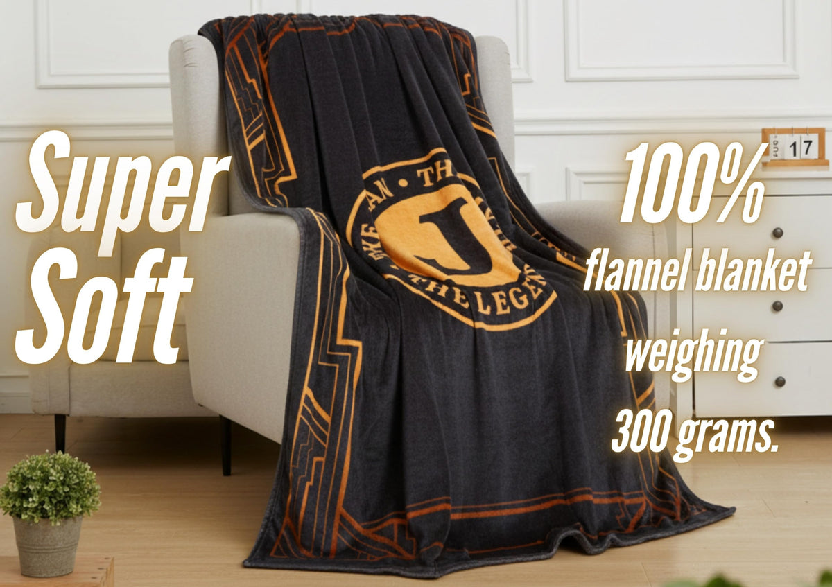 InnoBeta Legend Initial Plush Throw on bed with cozy bedside setup