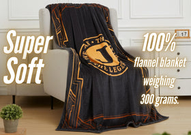 InnoBeta Legend Initial Plush Throw on bed with cozy bedside setup