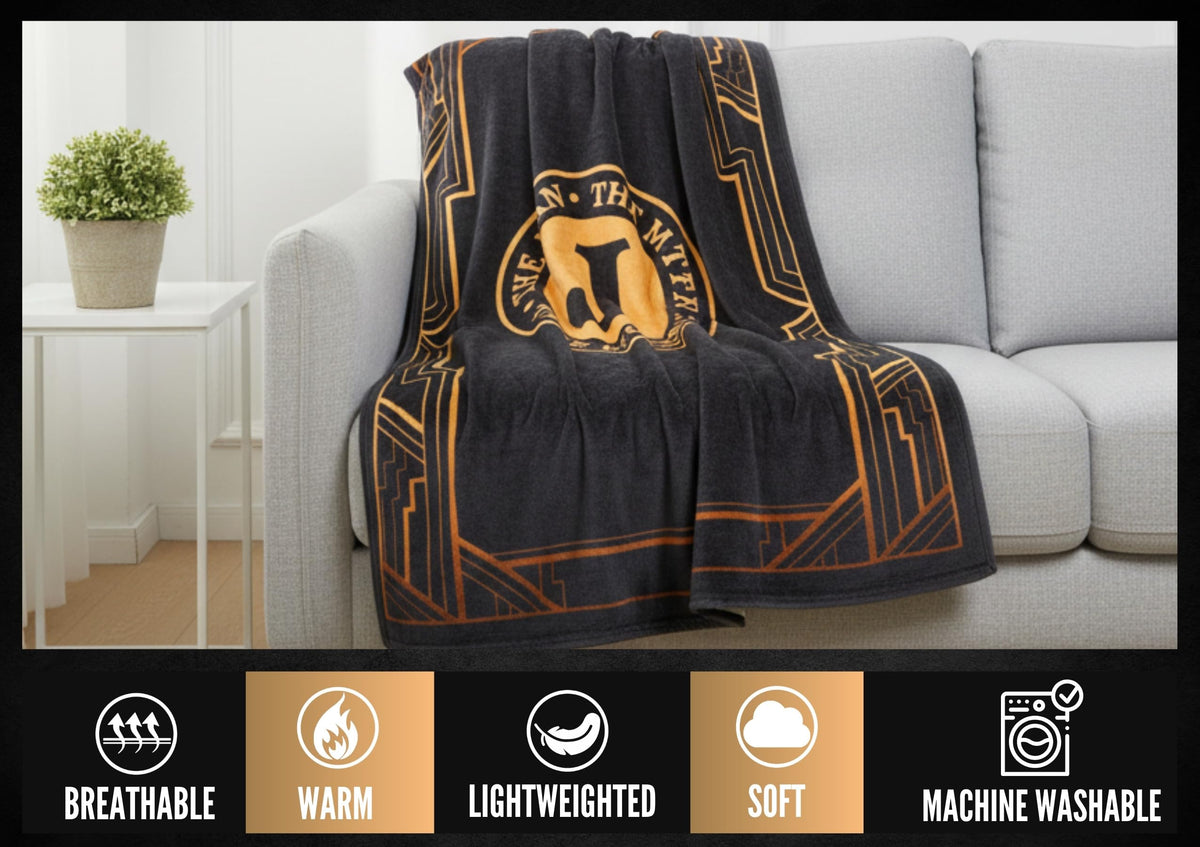 InnoBeta Legend Initial Plush Throw on a chair creating relaxing lounge ambience