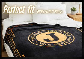 InnoBeta Legend Initial Plush Throw in neutral tones to suit masculine decor