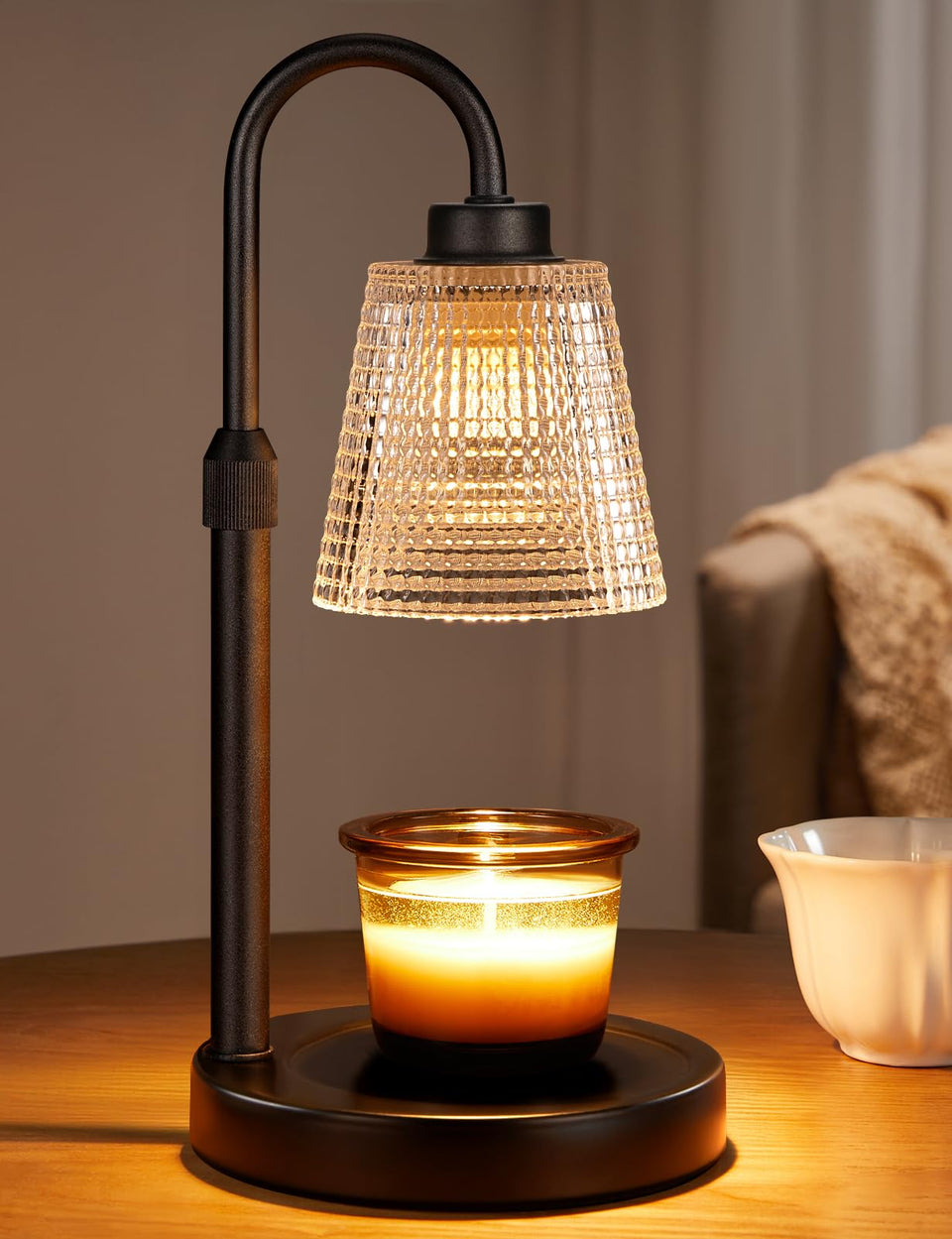 Innqoo candle warmer lamp glows softly, creating a cozy, flame-free ambience.
