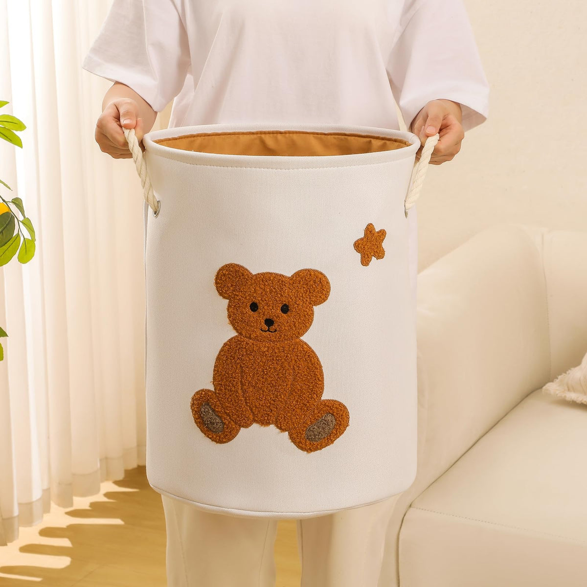 INough bear embroidery adds playful charm to a nursery or playroom.