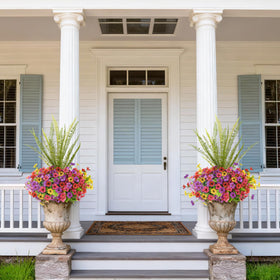 INQCMY weatherproof artificial flowers remain vibrant in sun and rain.