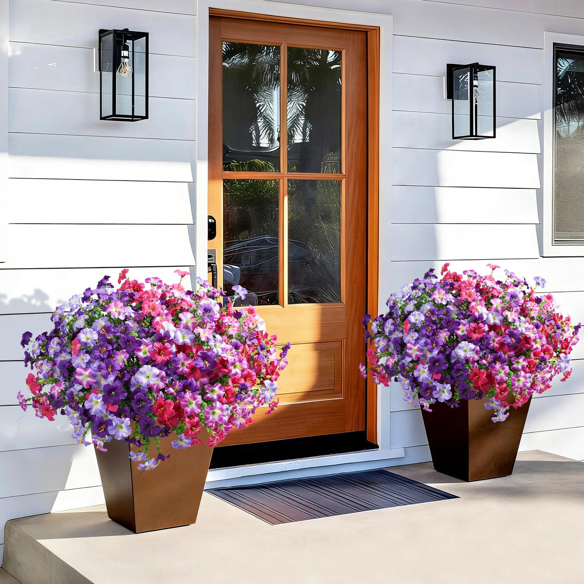 Outdoor urn planter filled with INSPRING petunias and eucalyptus, vivid color
