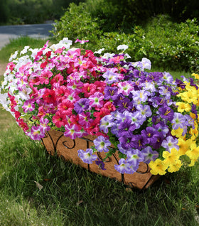 INSPRING artificial petunias with eucalyptus for outdoor displays that stay vibrant.