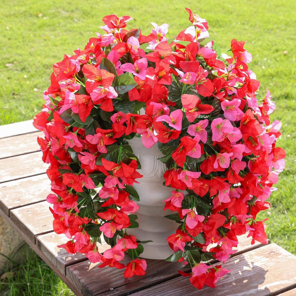 INSPRING artificial bougainvillea trailing vines on the porch add natural charm.