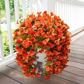 INSPRING orange faux bougainvillea flowers brighten entrances year-round.