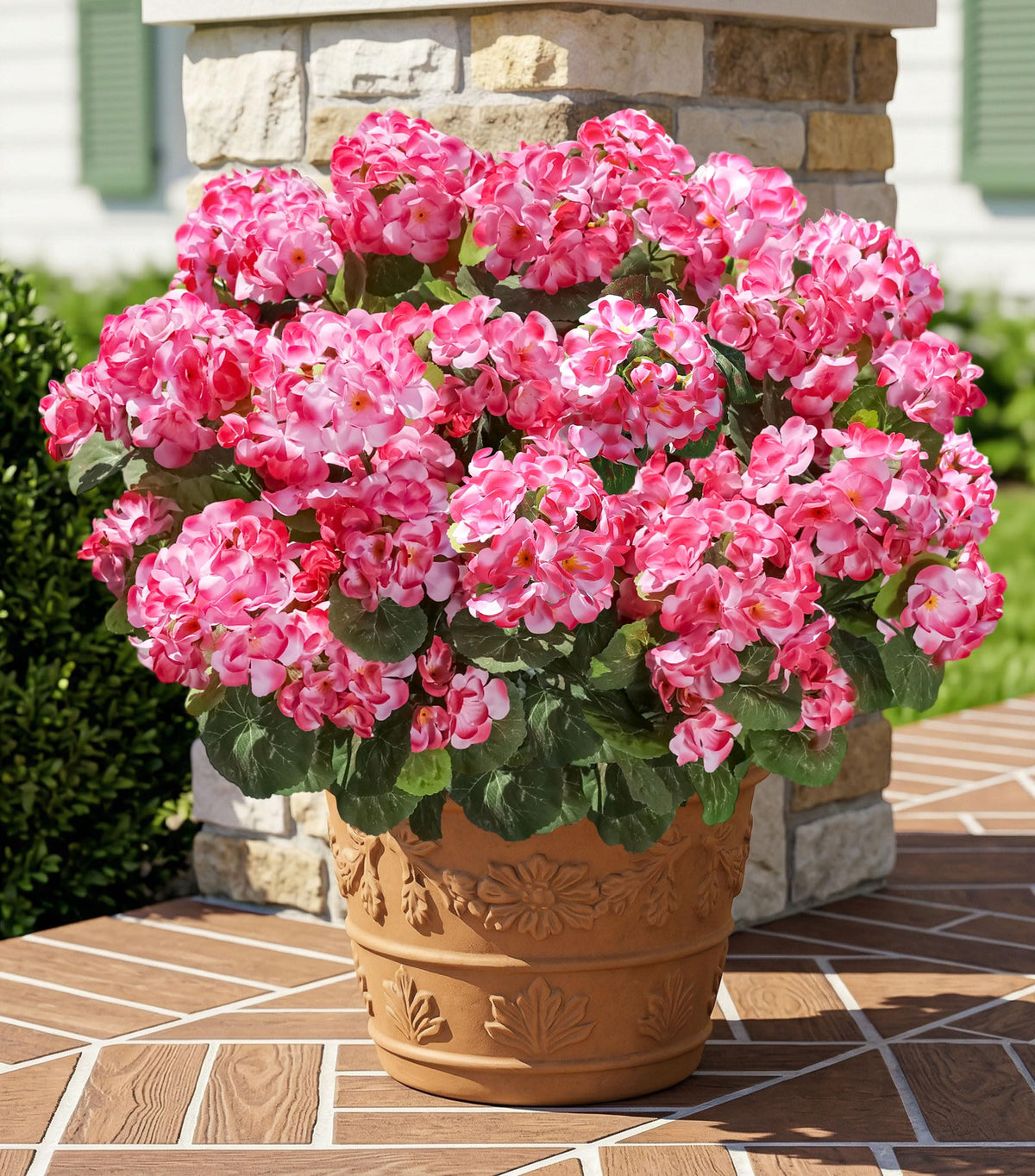 INSPRING pink silk geraniums close-up show vibrant petals and lifelike greenery.