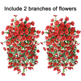 INSPRING red faux daisy close-up highlights vibrant color and silk texture.