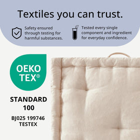 Intelligent Design Azza floor pillow ivory in-room setting, ready for reading, games, or lounging.