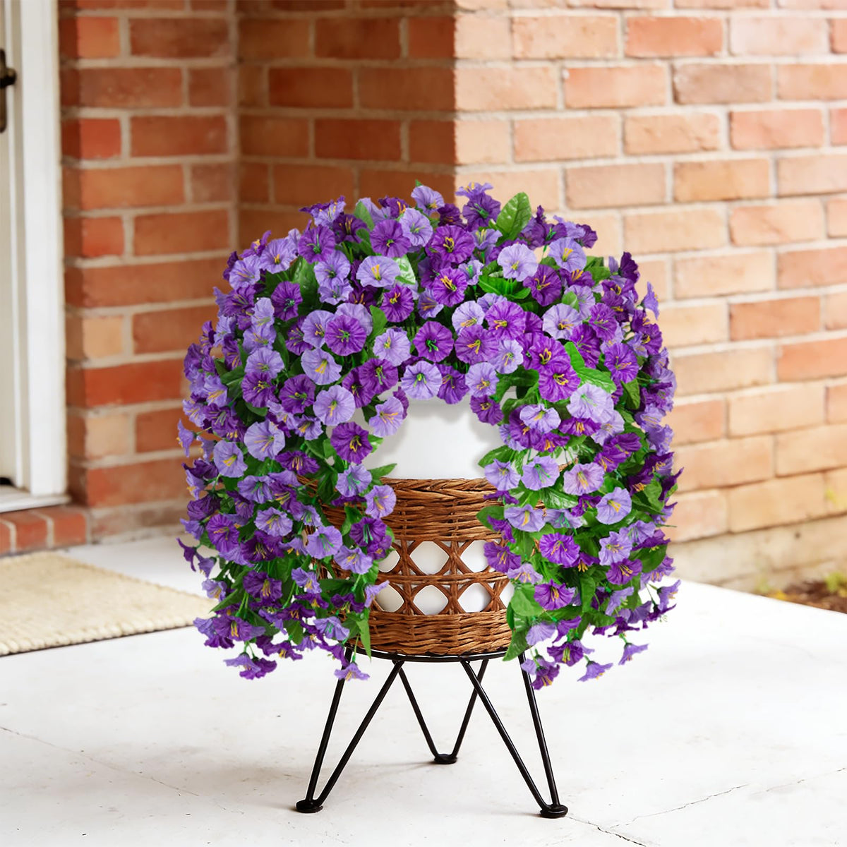 Silk flowers with leafy accents simulate real blooms with subtle texture.