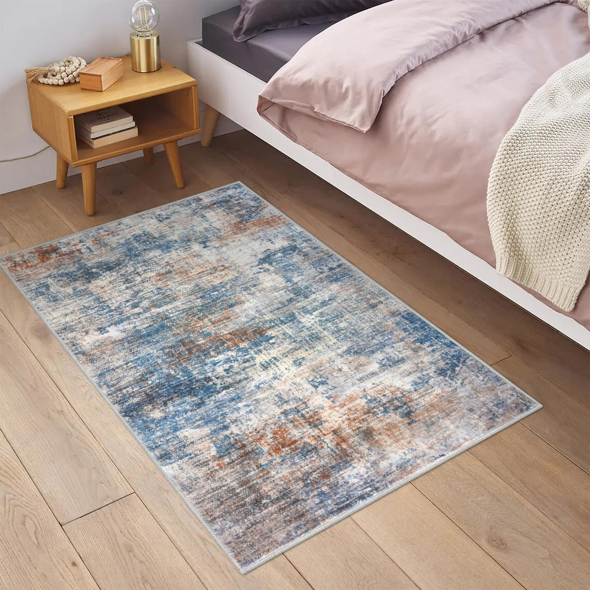 IOHOUZE abstract area rug 2x3 blue rust print shown in full view.