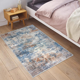 IOHOUZE abstract area rug 2x3 blue rust print shown in full view.