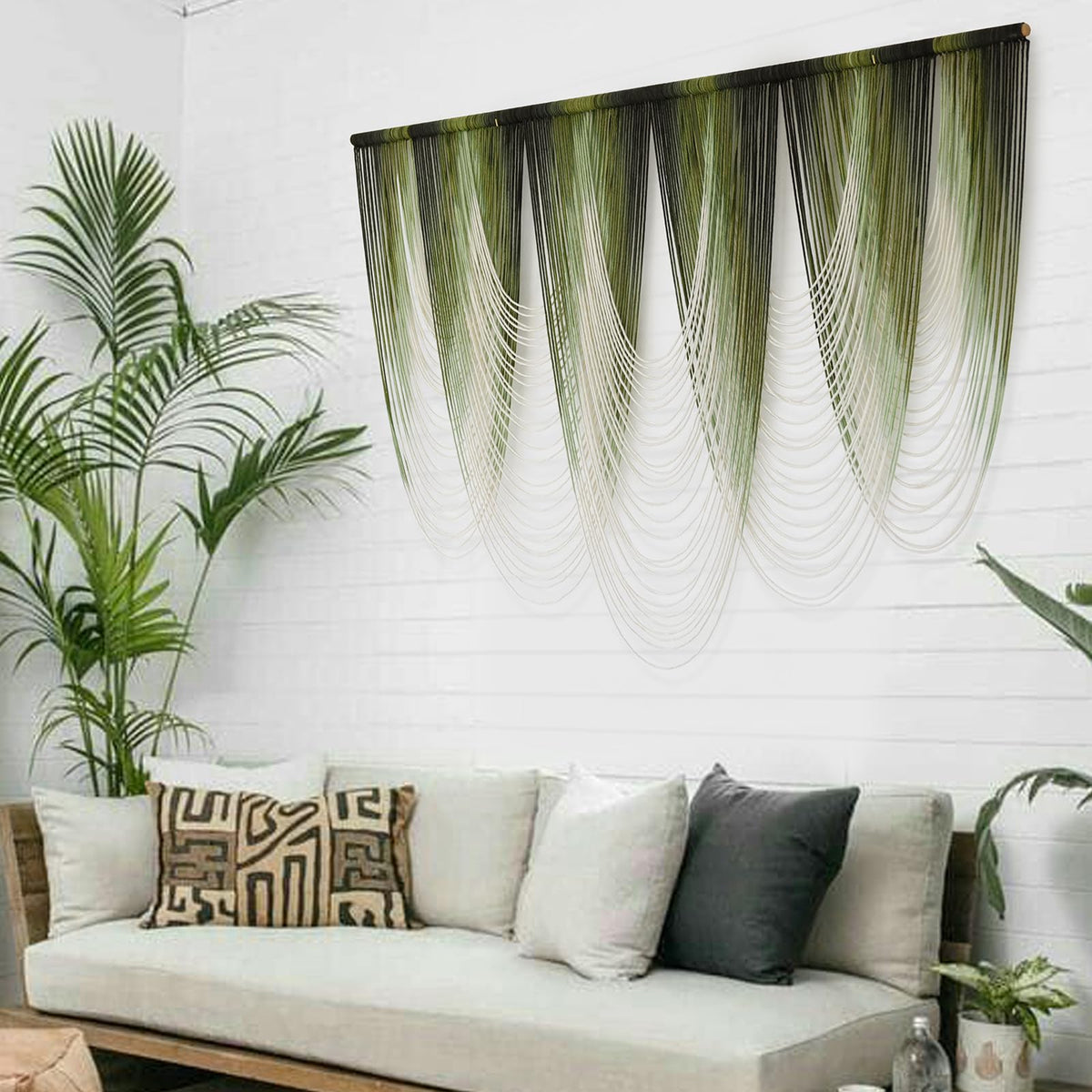 IOWER macrame wall hanging in a cozy bedroom setting