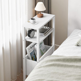 IRCPEN white narrow table beside bed supports lamp and cup