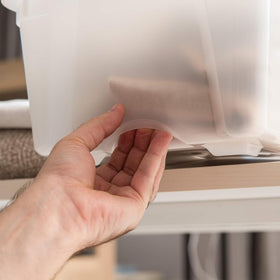 IRIS USA stackable bins with secure lids maximize vertical storage