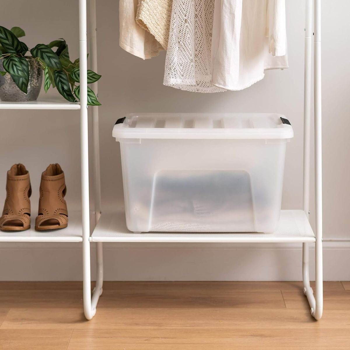 IRIS USA 40 Qt bin with locking lid protects contents on shelf