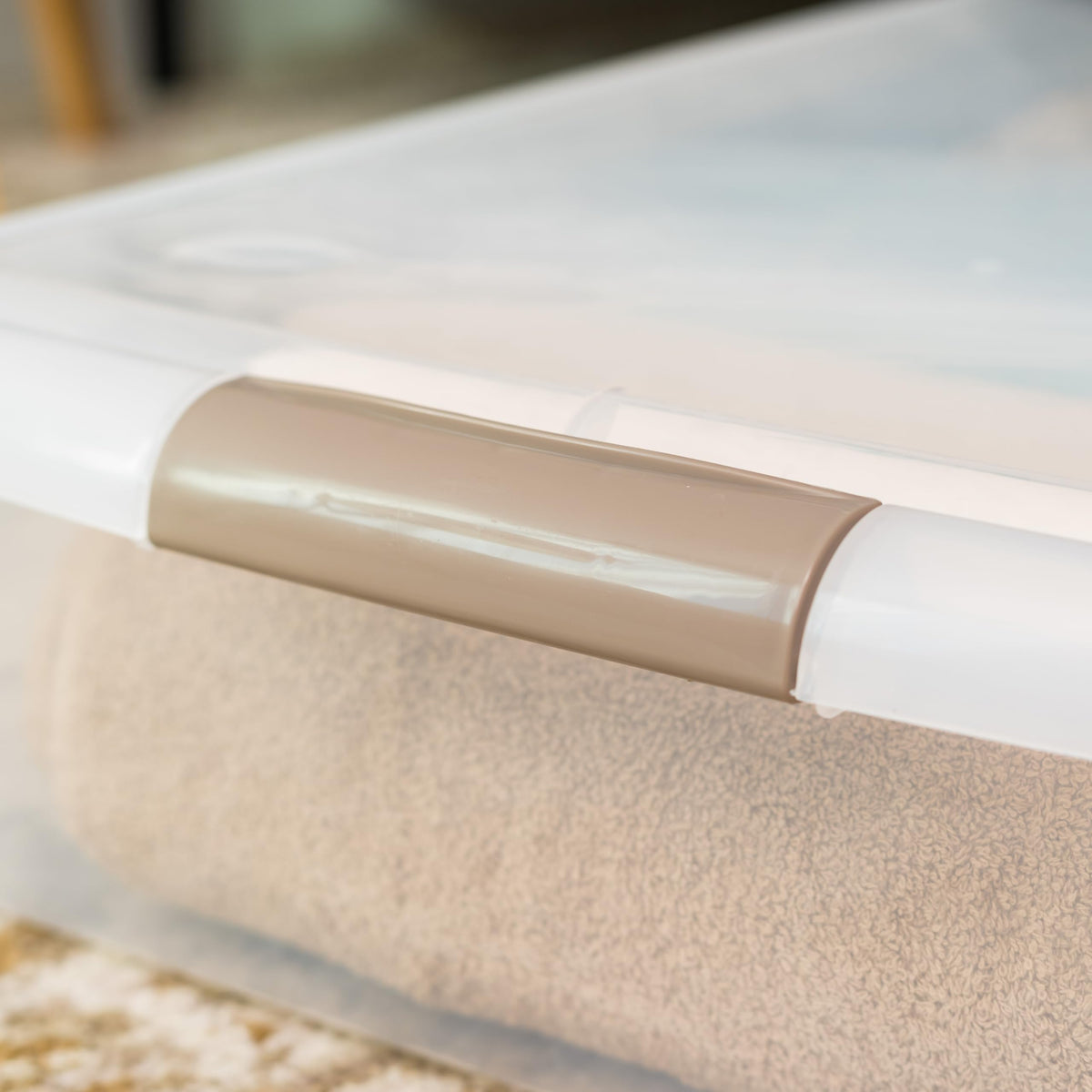 Iris USA bin stores clothes, blankets, and towels for easy under-bed access.