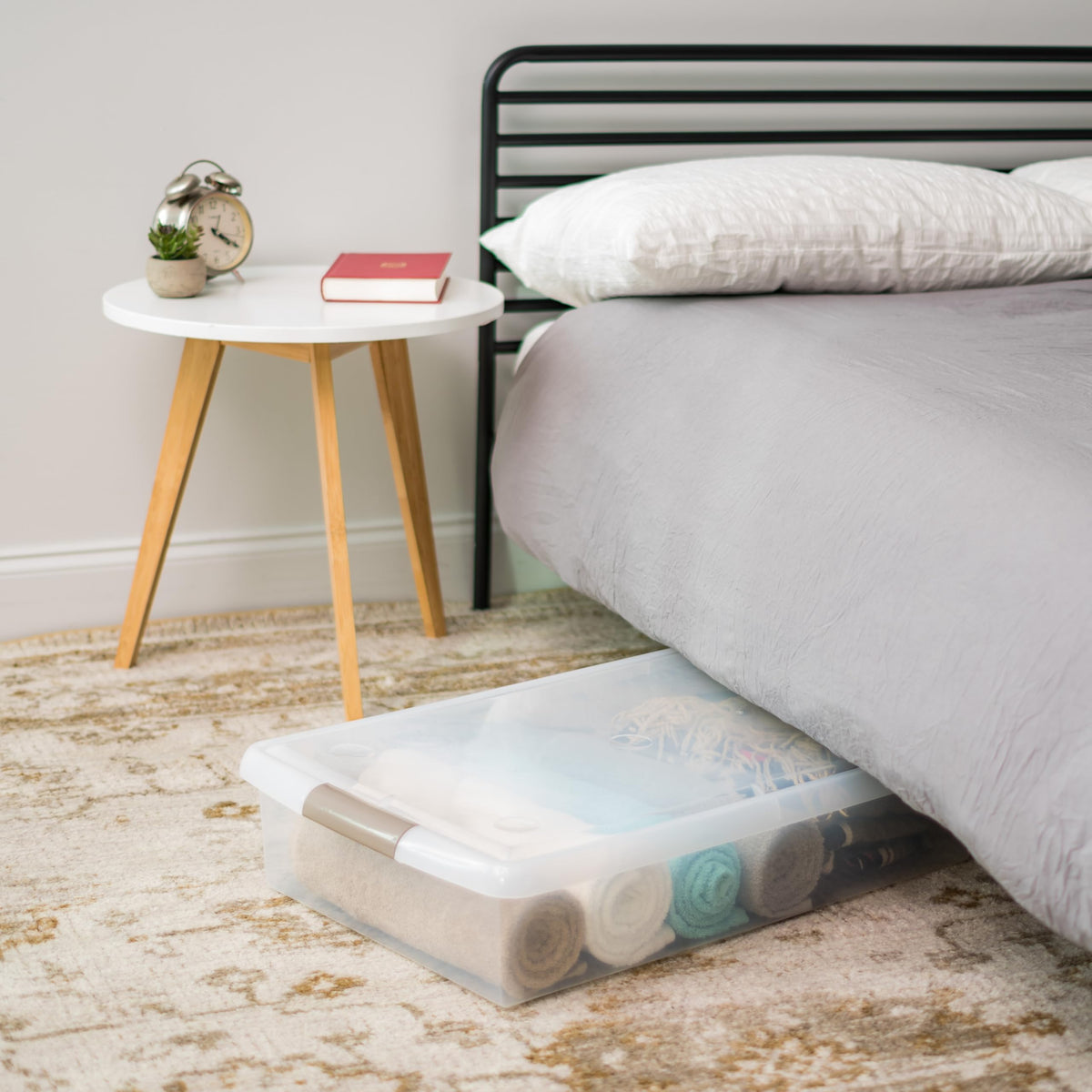 Secure lid on Iris USA bin keeps seasonal items dry and dust-free.