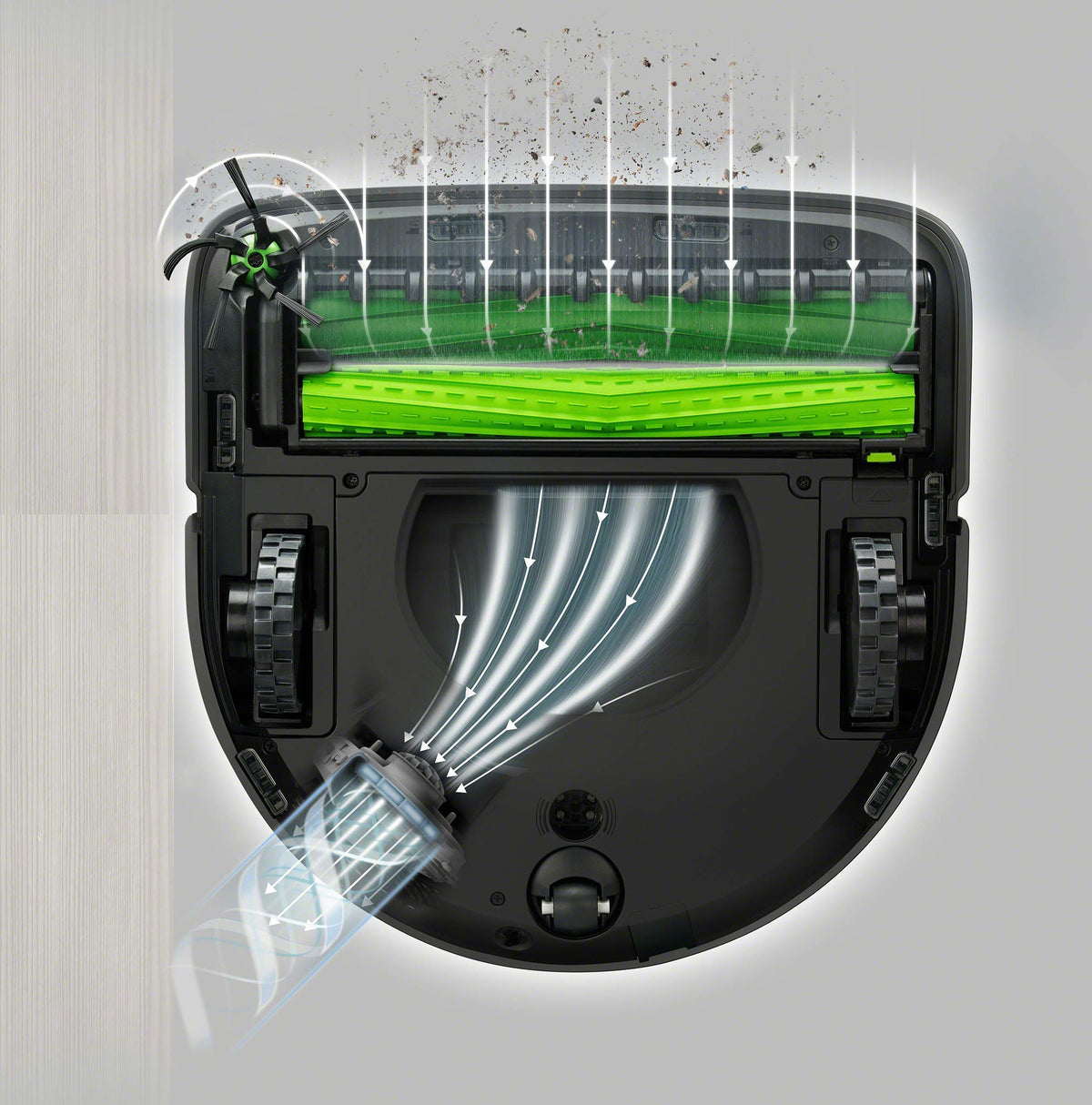 iRobot Roomba s Series brushes in use, capturing dirt with flexible rubber bristles for thorough pickup.