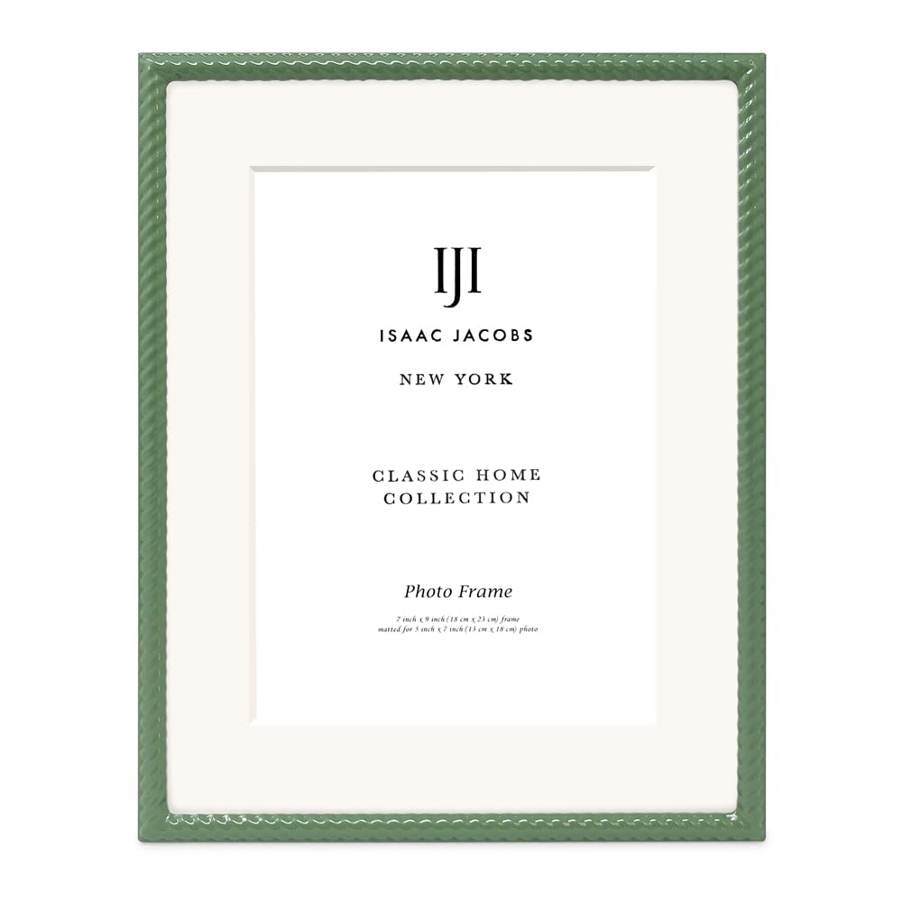 Isaac Jacobs green frame hung on wall adds rustic charm to decor.