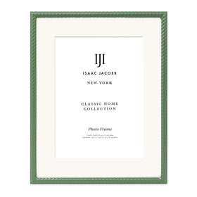 Isaac Jacobs green frame hung on wall adds rustic charm to decor.