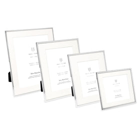 Isaac Jacobs silver frame in a cozy living room gallery wall