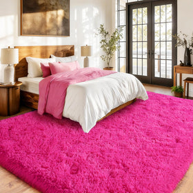 Isdook pink fuzzy rug in living room setup showcases bold color.