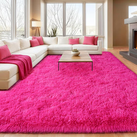 Isdook soft shaggy pink rug 4x6 in a cozy bedroom setting, inviting relaxation and play.