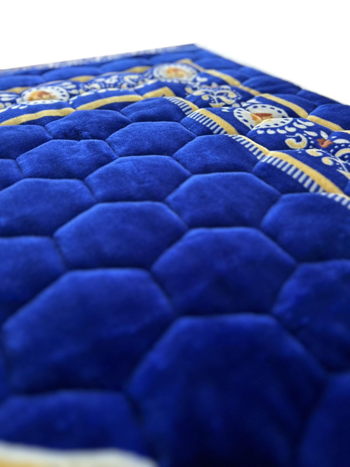 Islamika royal blue prayer rug close up reveals elegant Islamic motifs and soft texture