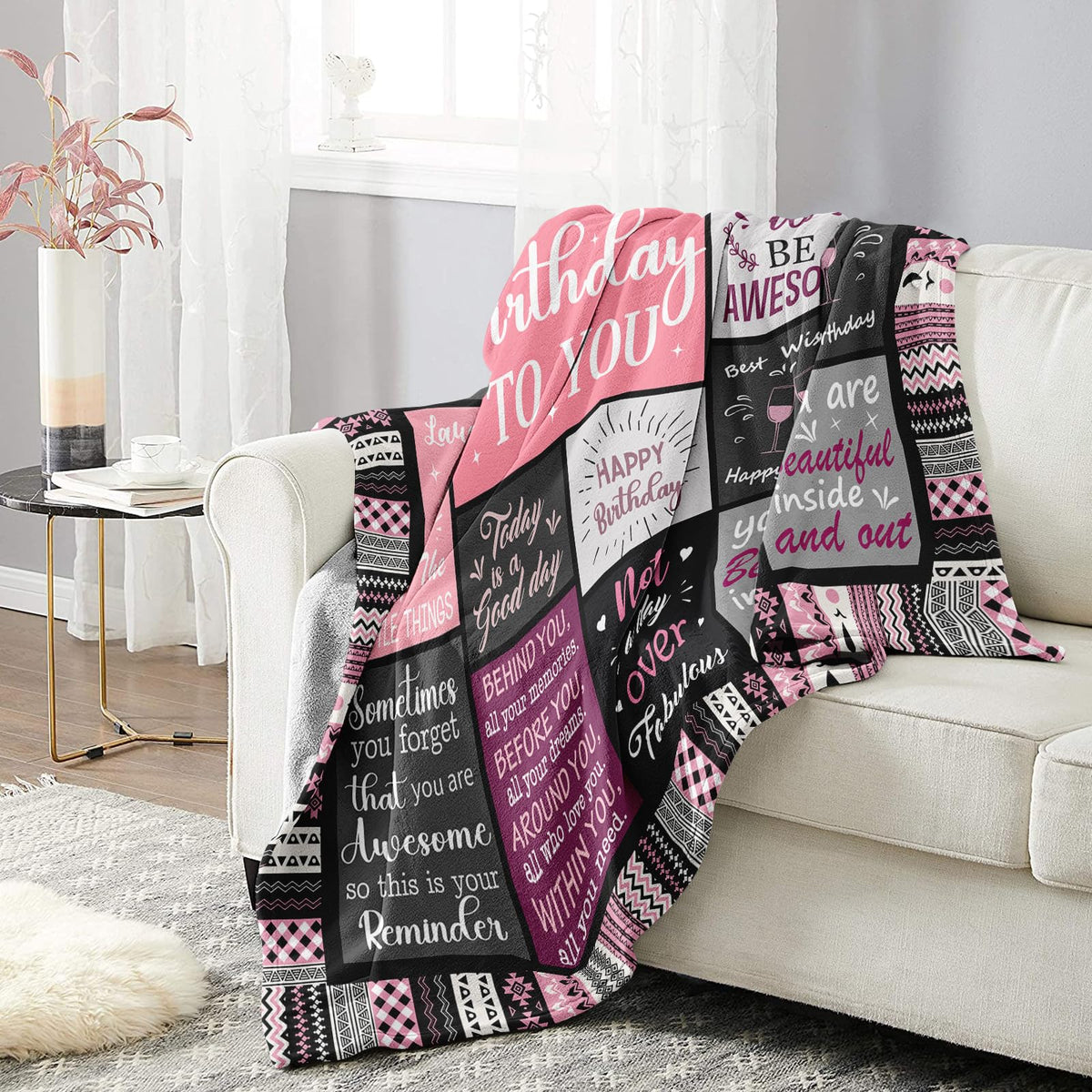 Ivivis blanket on the couch adds cozy movie-night comfort.