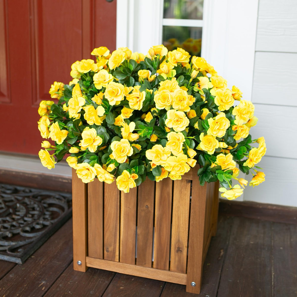Ivydale camellia faux flowers close-up showing realistic petals and yellow hue.
