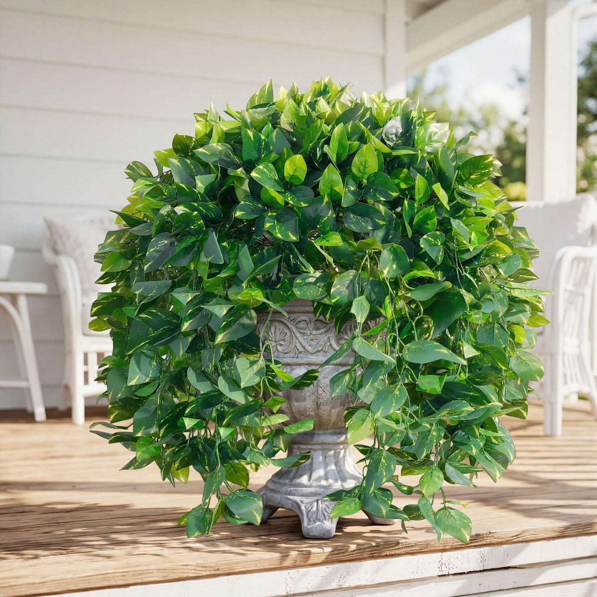 Ivydale hanging pothos by an urn for seasonal decor.
