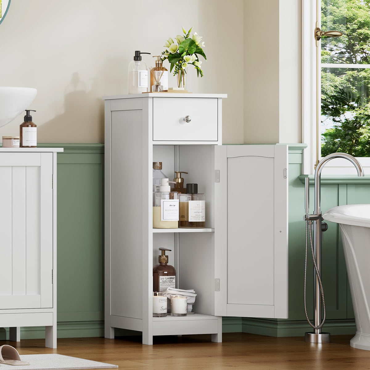 Iwell cabinet drawer open showing deep storage for wipes and toiletries.