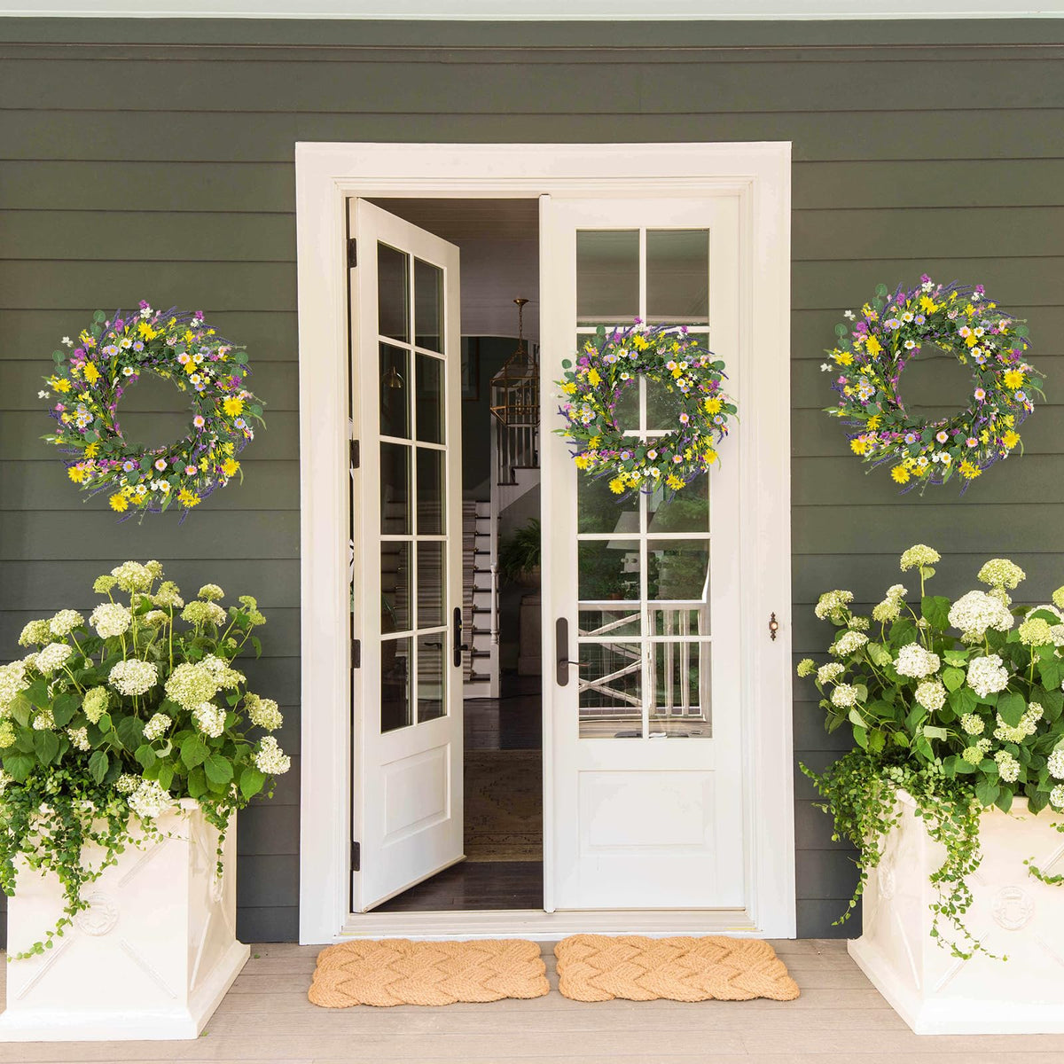 J'FLORU wreath detail emphasizes craftsmanship and realistic floral arrangement.