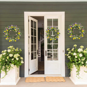 J'FLORU wreath detail emphasizes craftsmanship and realistic floral arrangement.