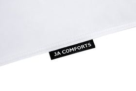 JA COMFORTS pillow close up shows double layer downproof fabric keeping feathers in place