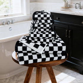 Jacquotha bathroom decor setup with checkered pattern matching modern style