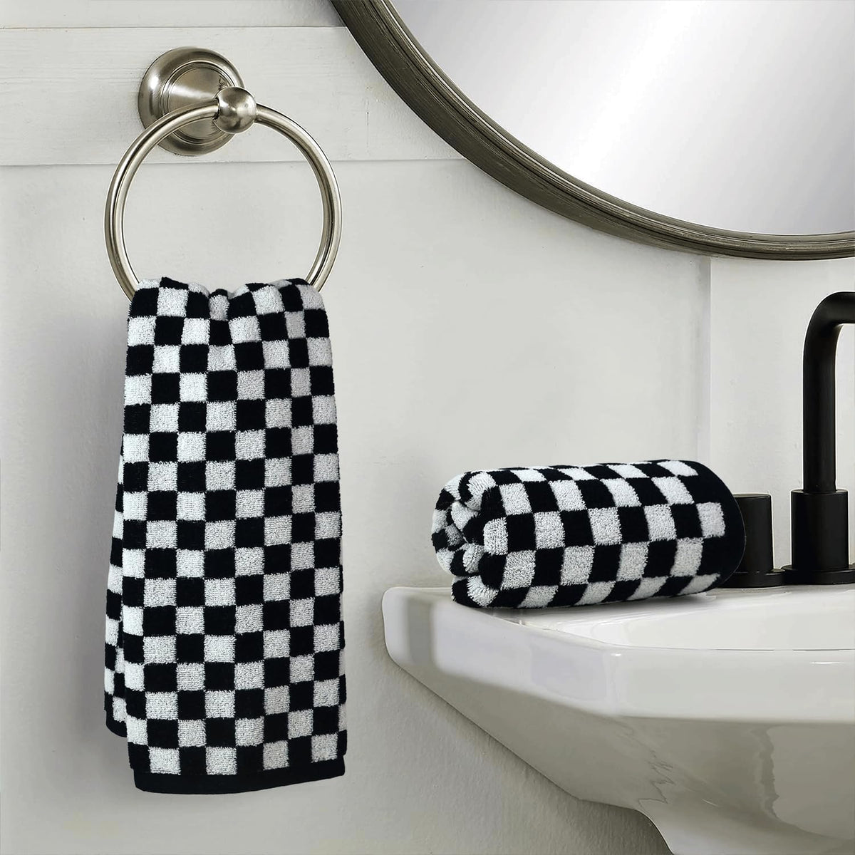 Jacquotha bathroom decor with towels on rack enhancing chic, coordinated space.