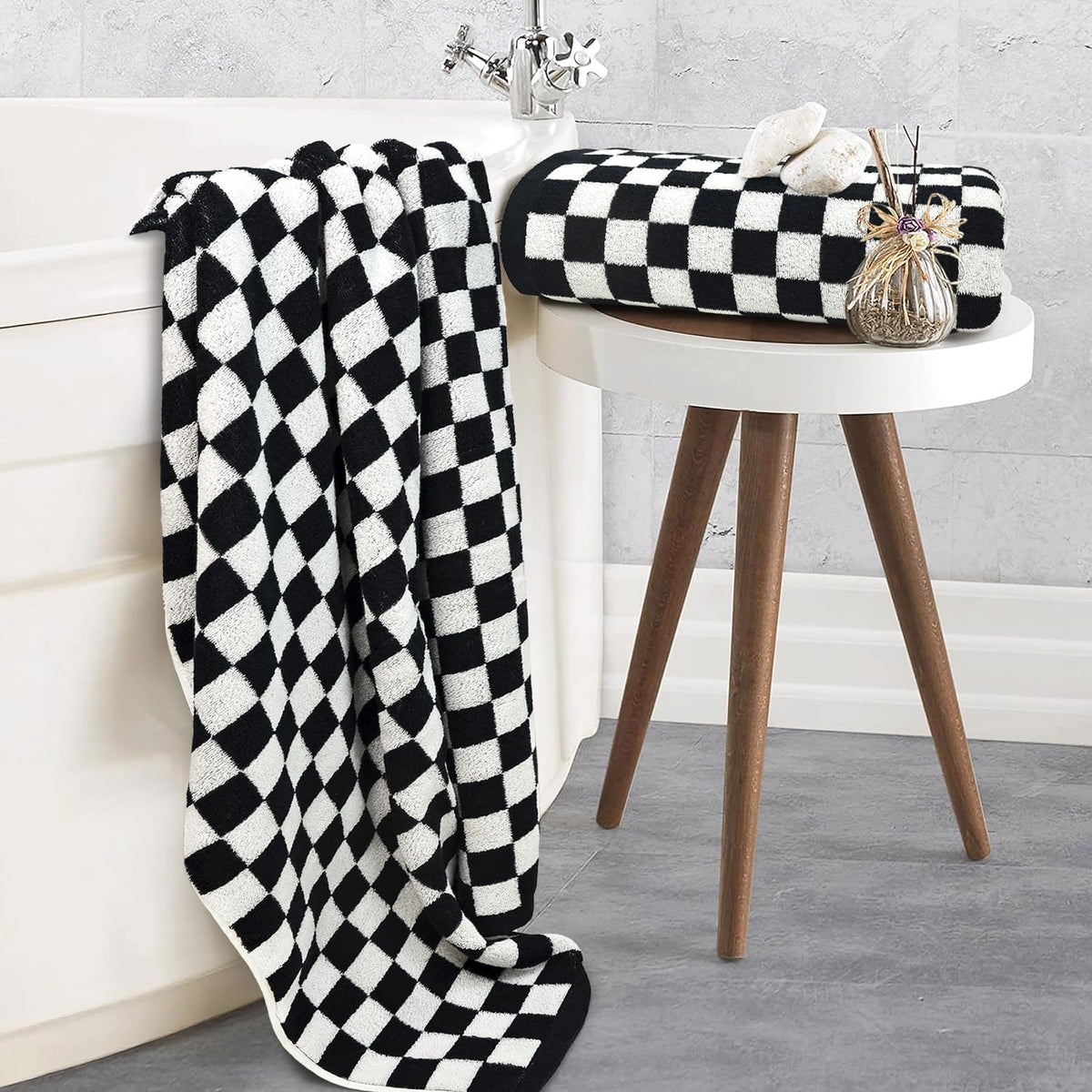 Jacquotha checkered towels draped over rack highlighting modern decor and cozy everyday luxury.