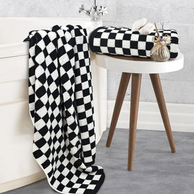 Jacquotha checkered towels draped over rack highlighting modern decor and cozy everyday luxury.