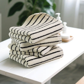 Close-up of Jacquotha towel texture, showing a smooth cotton weave.