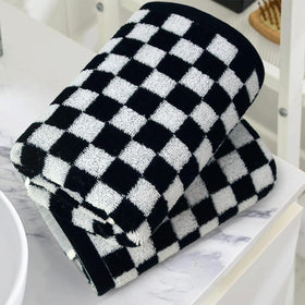 Jacquotha kitchen-use towels in checkered pattern ideal for quick hand drying by sink.