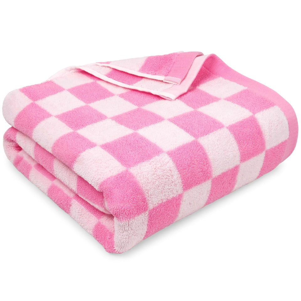 Jacquotha pink checkered beach towel spread on sand for sunny lounging