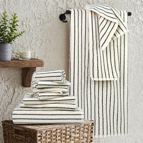 Jacquotha striped towels hanging to showcase modern bathroom decor