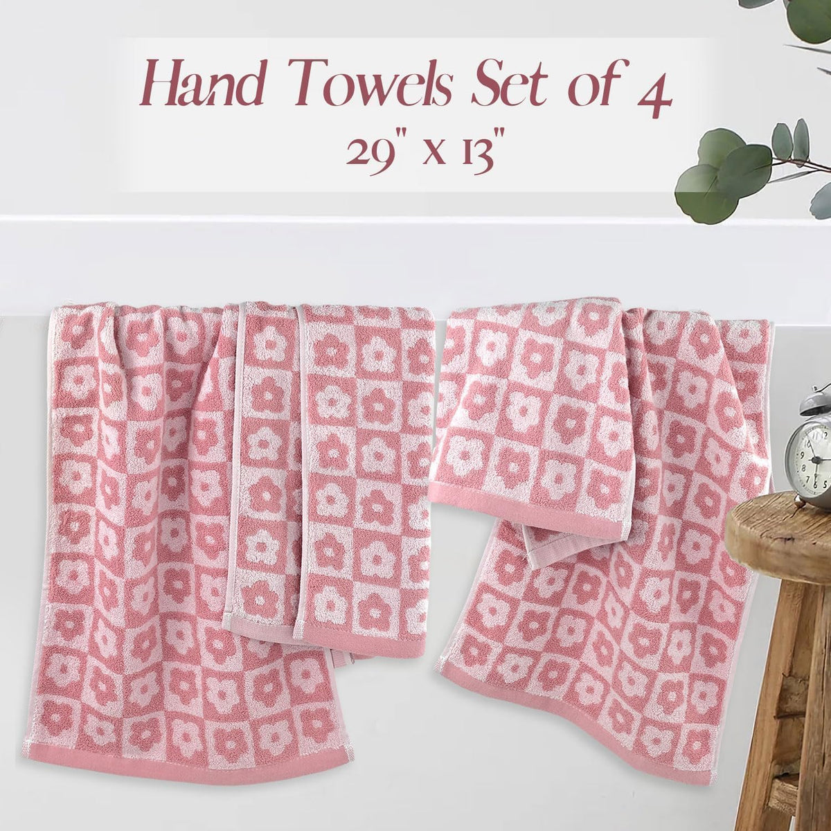Jacquotha vibrant pink bathroom decor towels displayed on rack.